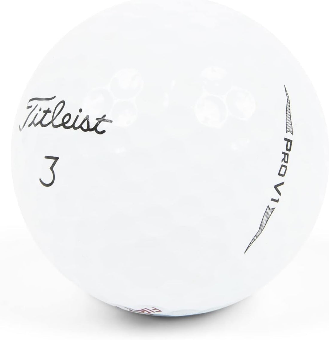 Close-up of various golf balls and personalized tees on a serene golf course at sunrise.