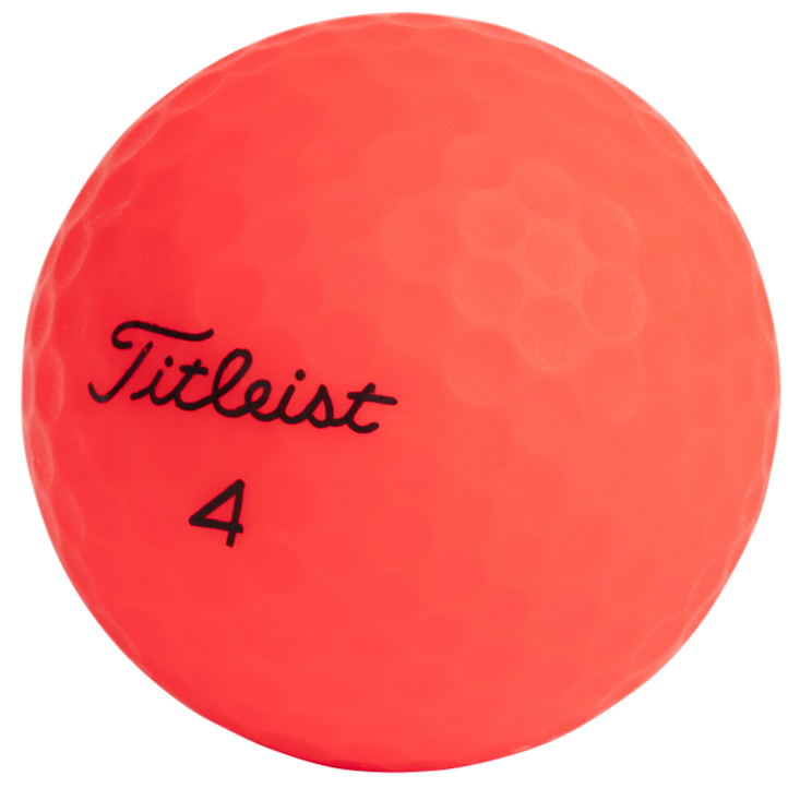Red golf ball with 'Titleist' branding on a white background