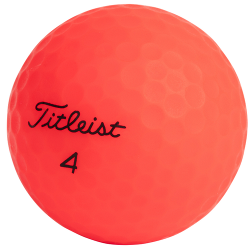 Red golf ball with 'Titleist' branding on a white background