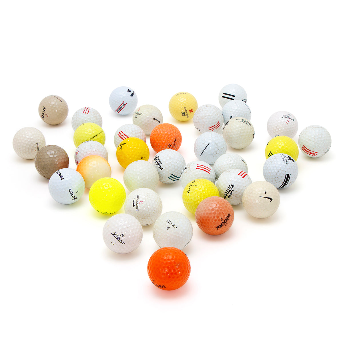 a bunch of shag golf balls on white backdrop
