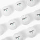 rows of srixon soft feel golf balls on white background